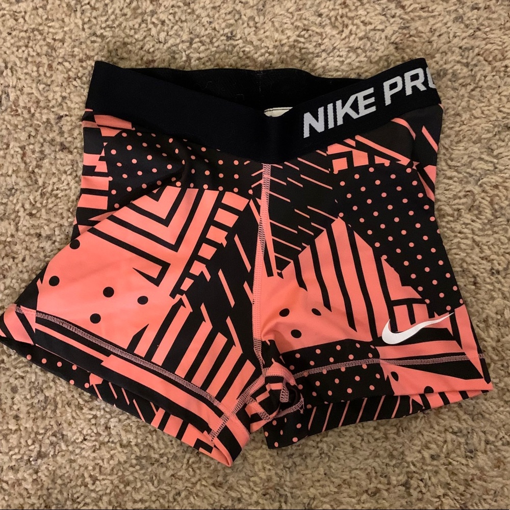 Pink and black nike pro spandex shorts